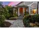 Entryway with lush landscaping and brick walkway at 585 Gunwale Ln, Longboat Key, FL 34228