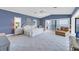 Spacious main bedroom with water views and sitting area at 585 Gunwale Ln, Longboat Key, FL 34228