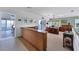 Home office with built-in wooden desk and water views at 585 Gunwale Ln, Longboat Key, FL 34228