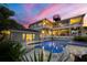 Luxury pool and spa area with a beautiful sunset view at 585 Gunwale Ln, Longboat Key, FL 34228