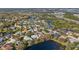 Aerial view of a residential area with a lake at 6207 Warbler Ln, Lakewood Ranch, FL 34202