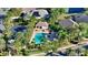 Community boasts a refreshing pool, lush landscaping, and cabana at 7615 Windward Cv, Lakewood Ranch, FL 34202