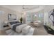 Main bedroom with bay window, neutral decor and sitting area at 7615 Windward Cv, Lakewood Ranch, FL 34202
