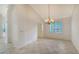 Formal dining area with a chandelier and access to kitchen at 7615 Windward Cv, Lakewood Ranch, FL 34202