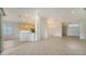Bright kitchen with a breakfast bar and view to the living room at 7615 Windward Cv, Lakewood Ranch, FL 34202