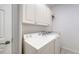 Convenient laundry room with washer, dryer, and ample storage at 7615 Windward Cv, Lakewood Ranch, FL 34202