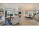 Spacious living room with a dining area and plenty of natural light at 7615 Windward Cv, Lakewood Ranch, FL 34202
