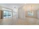 Open concept living and dining area with tile floors at 7615 Windward Cv, Lakewood Ranch, FL 34202