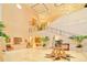 Grand clubhouse lobby with high ceilings and elegant staircase at 7615 Windward Cv, Lakewood Ranch, FL 34202