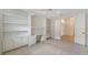 Bright and airy office with built-in shelving and access to other rooms at 7615 Windward Cv, Lakewood Ranch, FL 34202