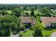 Aerial view of single-Gathering home on a golf course community at 8033 Fairhaven Gln, University Park, FL 34201