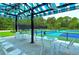 Covered patio area overlooking pickleball courts at 8033 Fairhaven Gln, University Park, FL 34201