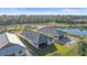 Aerial view of two houses under construction with a view of a pond at 8387 Windbound Ct, Sarasota, FL 34240