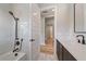 Bathroom with subway tile shower and dark vanity at 8387 Windbound Ct, Sarasota, FL 34240