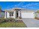 Modern house exterior with gray tile roof and white walls at 8387 Windbound Ct, Sarasota, FL 34240