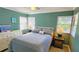 Cozy bedroom with a double bed, dresser, and two windows with blinds at 847 Myrtle St, Sarasota, FL 34234