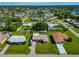 Aerial view of a residential neighborhood, highlighting a single-Gathering home with a spacious yard at 3145 Kingston St, Port Charlotte, FL 33952