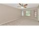 Bright bedroom with bay window and ceiling fan at 3145 Kingston St, Port Charlotte, FL 33952