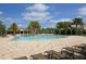 Resort-style pool with lounge chairs and a clubhouse at 11454 Rolling Green Dr, Bradenton, FL 34211