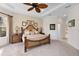 Spacious Primary bedroom with a king-size bed and ensuite bathroom at 12240 Thornhill Ct, Lakewood Ranch, FL 34202