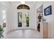 Bright and airy foyer with double doors and tile flooring at 12240 Thornhill Ct, Lakewood Ranch, FL 34202