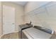 Laundry room with washer, dryer, and shelving at 13051 Utopia Loop, Bradenton, FL 34211