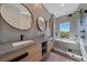 Modern bathroom with double sinks, a large walk-in shower, and stylish fixtures at 1720 Alderman St, Sarasota, FL 34236