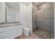 Contemporary bathroom featuring a single sink vanity, toilet, and a frameless shower at 1720 Alderman St, Sarasota, FL 34236