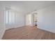 Bright bedroom with wood-look floors and an ensuite bathroom at 1720 Alderman St, Sarasota, FL 34236