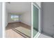 Bright bedroom with hardwood floors and large window with city view at 1720 Alderman St, Sarasota, FL 34236