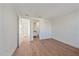 Light-filled bedroom featuring wood-look floors and access to a bathroom at 1720 Alderman St, Sarasota, FL 34236