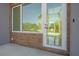 Townhouse entry with glass door, wood-like tile, and modern fixtures at 1720 Alderman St, Sarasota, FL 34236