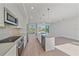 Modern kitchen with island and stainless steel appliances at 1720 Alderman St, Sarasota, FL 34236