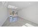 Spacious living area with large windows and sleek grey tile floors at 1720 Alderman St, Sarasota, FL 34236