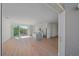 Open concept living room with kitchen and access to balcony at 1720 Alderman St, Sarasota, FL 34236