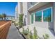 Modern townhouse with private patio, walkway, and wooden fence at 1720 Alderman St, Sarasota, FL 34236