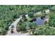 Community overview with lush landscaping and pond at 19439 Beacon Park Pl, Bradenton, FL 34202