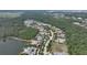 Aerial view of a new community with houses surrounding a lake at 19439 Beacon Park Pl, Bradenton, FL 34202