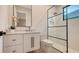 Modern bathroom with a walk-in shower and floating vanity at 19439 Beacon Park Pl, Bradenton, FL 34202