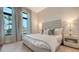Bedroom with large windows and neutral decor at 19439 Beacon Park Pl, Bradenton, FL 34202