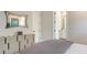 Bedroom with ensuite bathroom and modern dresser at 19439 Beacon Park Pl, Bradenton, FL 34202