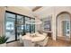 Elegant dining room features a round table and stunning water views at 19439 Beacon Park Pl, Bradenton, FL 34202