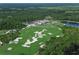 Aerial view of golf course and luxury clubhouse at 19439 Beacon Park Pl, Bradenton, FL 34202
