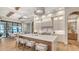 Spacious kitchen island with seating overlooks a breakfast nook and water views at 19439 Beacon Park Pl, Bradenton, FL 34202