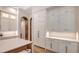 Well-equipped kitchen boasts white cabinetry, built-in refrigerator, and expansive counter space at 19439 Beacon Park Pl, Bradenton, FL 34202