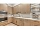 Light oak kitchen cabinets, quartz countertops and high-end stainless steel appliances at 19439 Beacon Park Pl, Bradenton, FL 34202