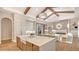 Open concept kitchen with island, high-end appliances, and ample cabinetry at 19439 Beacon Park Pl, Bradenton, FL 34202