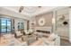 Bright and airy living room with a fireplace and built-in shelving at 19439 Beacon Park Pl, Bradenton, FL 34202