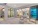 Relaxing outdoor patio with seating area, offering views into the great room at 19439 Beacon Park Pl, Bradenton, FL 34202