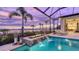 Peaceful pool area with fire pit and water features, offering scenic views at 19439 Beacon Park Pl, Bradenton, FL 34202